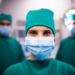Portrait of female surgeon standing in a operating room